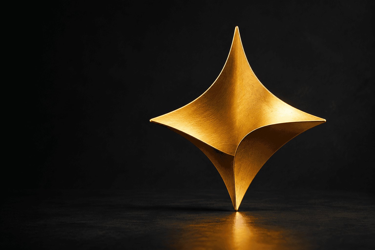 Una chispa dorada de cuatro puntas, inspirada en la luz del logo de Loomin Lab